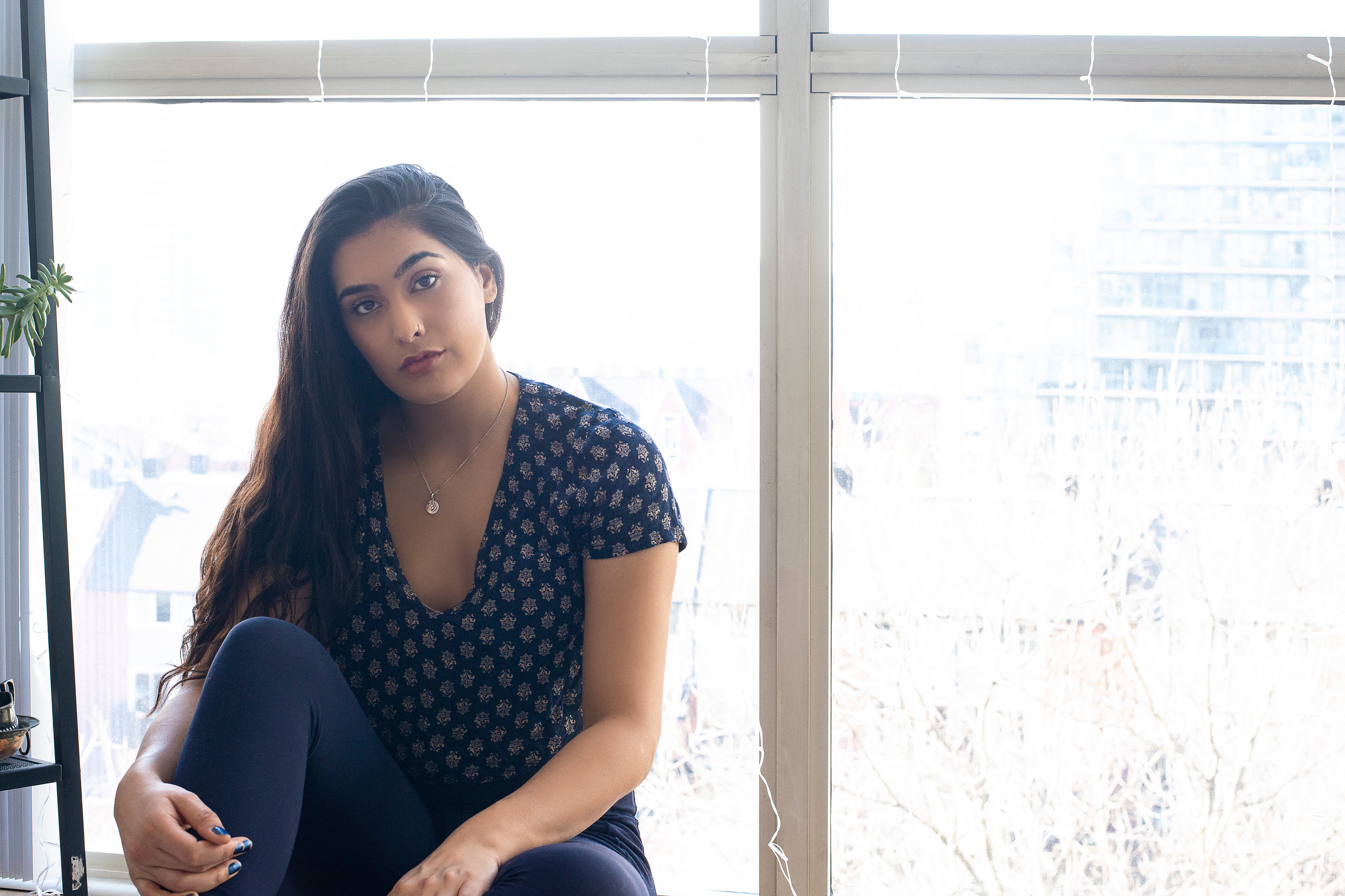 files/woman-in-blue-in-front-of-a-window.jpg